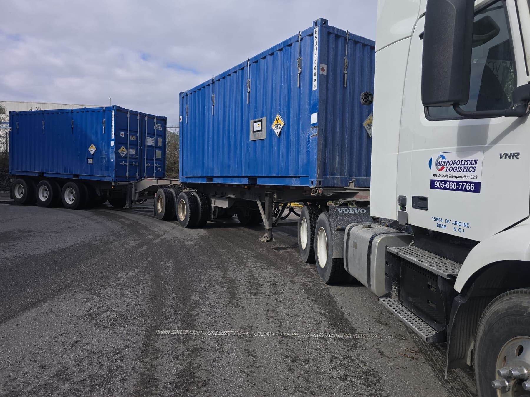 Metropolitan Logistics tractor pulling two 20-foot containers
