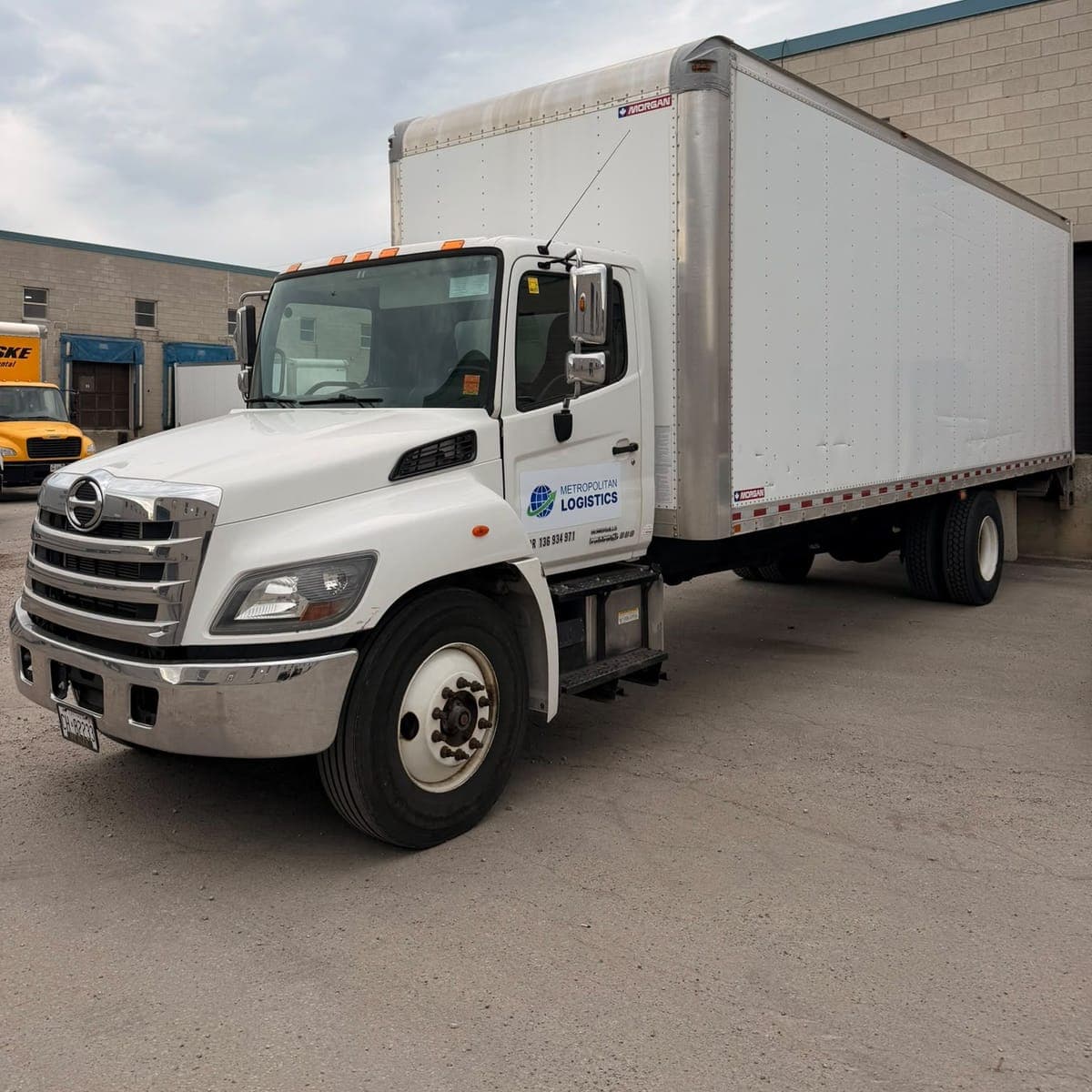Metropolitan Logistics straight truck at the warehouse dock area